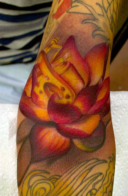 orange lotus flower tattoo