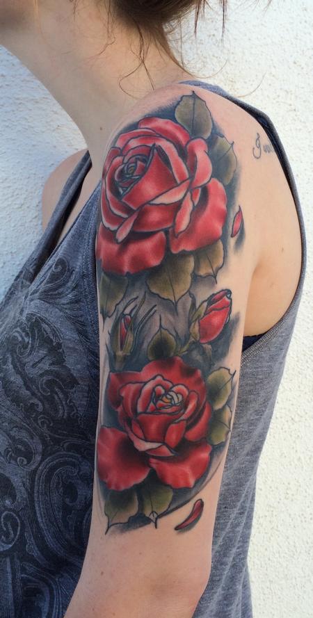 Single colored rose tattoo on a sleeve