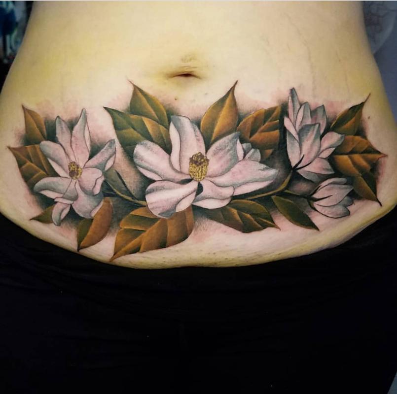 Stomach flower tattoo by Ben Amos TattooNOW