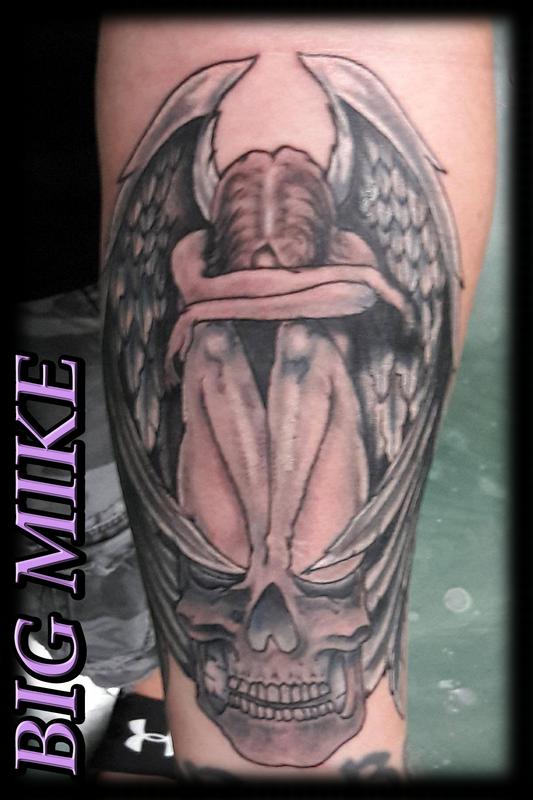 angel crying tattoo