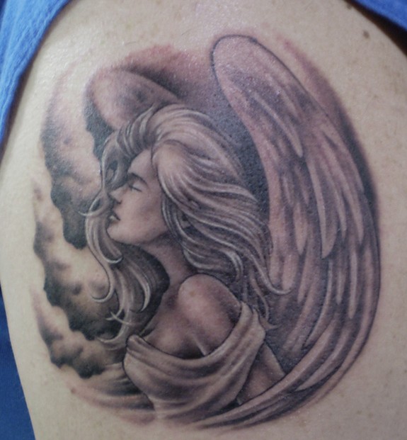 This is a little angel tattoo on the upper arm It took about an hour maybe 