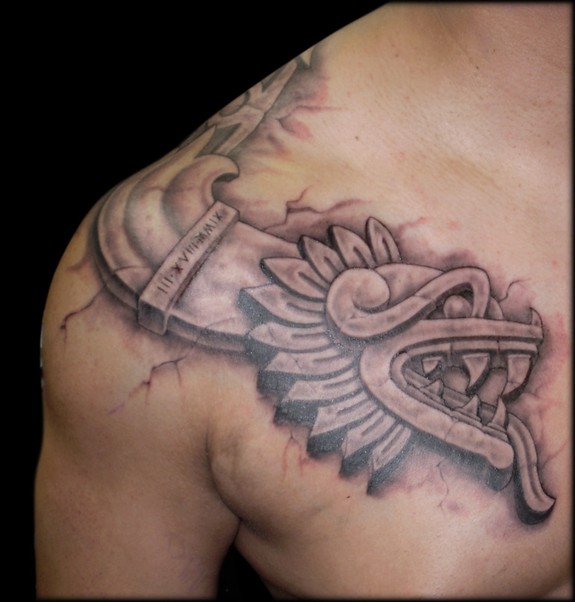 Aztec serpent shoulder tattoo This piece continues over the shoulder and is