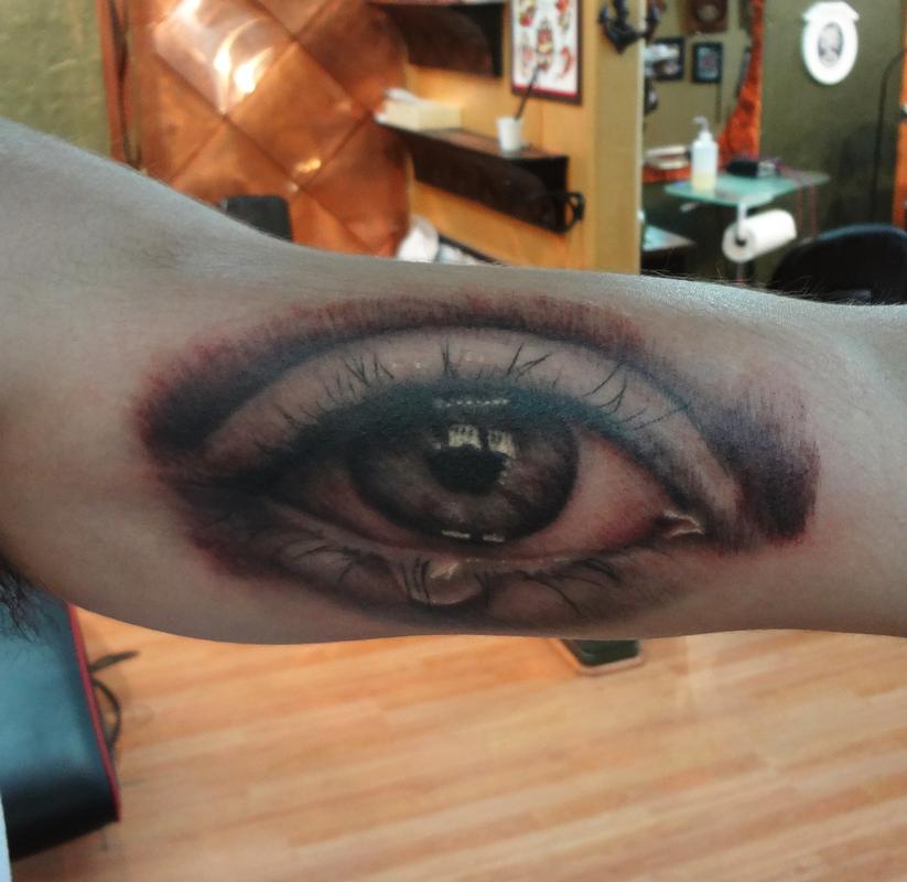 eyeball tattoo on arm by Ian Robert McKown TattooNOW