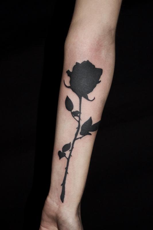 Solid Black Rose Silhouette tattoo on forearm by Ben Licata: TattooNOW