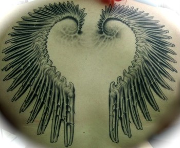 skeleton wings back tattoo