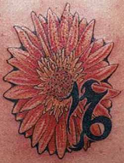 Uncle Eddie - Flower and symbol tattoo