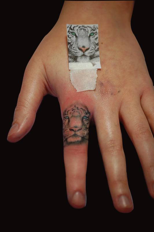 Tiger Tattoo On Finger