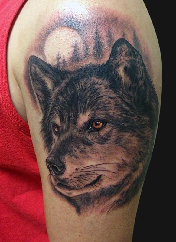 Black And Grey Wolf Portrait Tattoo On The Thigh