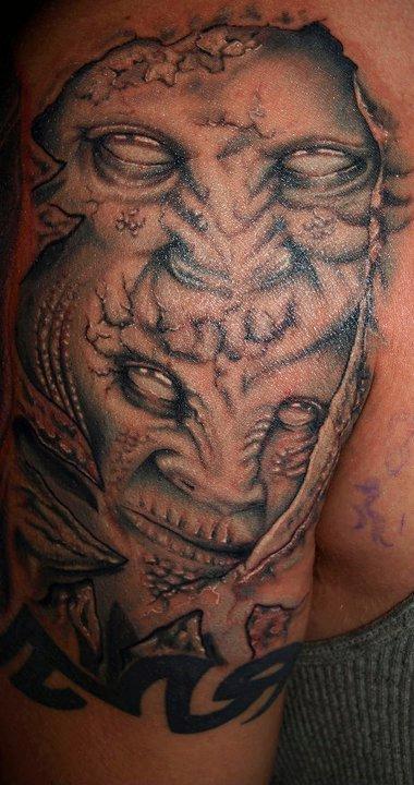 Cesar Perez Tattoos - black and grey demos faces tattoo