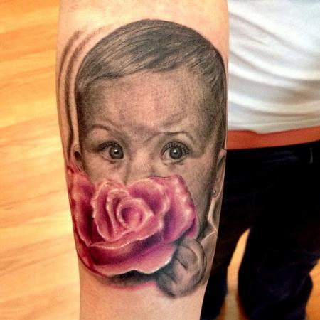 Cesar Perez Tattoos - baby holding a rose portrait