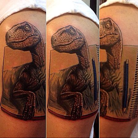 Cesar Perez Tattoos - dinosaur velociraptor coming out of sketchbook