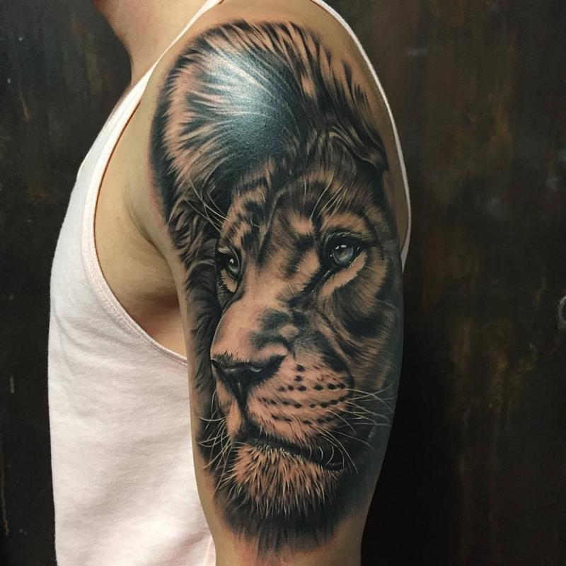 Realistic Lion Face in Black and Gray by Yarda Tattoos