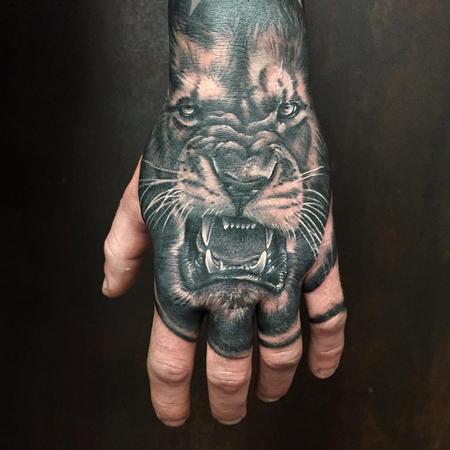 Tattoos - Realistic Lion in Black and Gray on the Back of a Hand - 126517