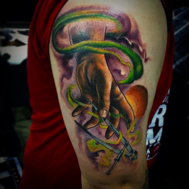 Hand/wormhole by Joe Miller Tattoos