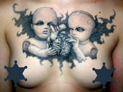 Paul Booth - Dolls with anatomical heart chest tattoo