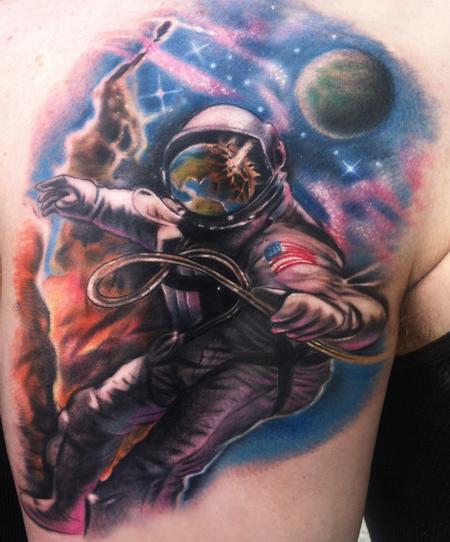 Tattoos - astronaut watching earth explode - 74392