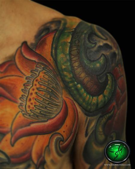 Andre Cheko - Lotus flower color sleeve tattoo close up.