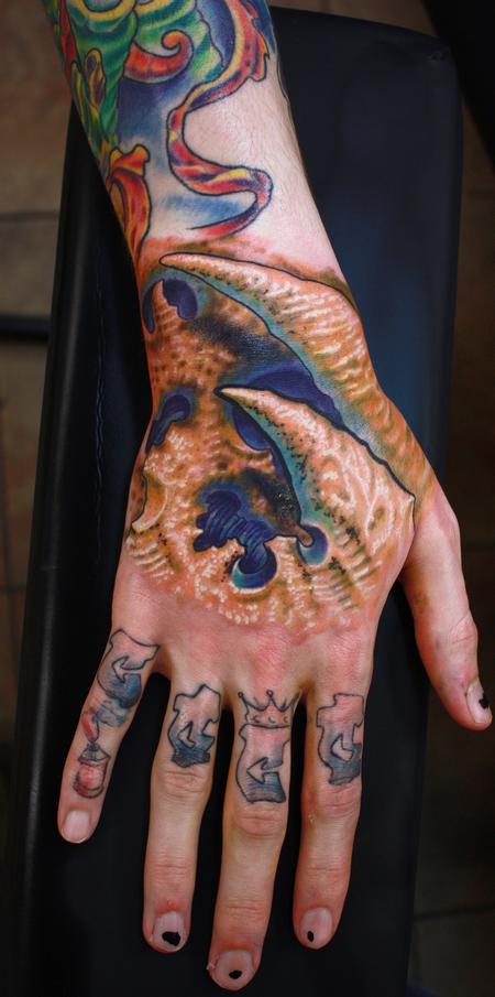 Ty McEwen - coral bio-organic hand tattoo