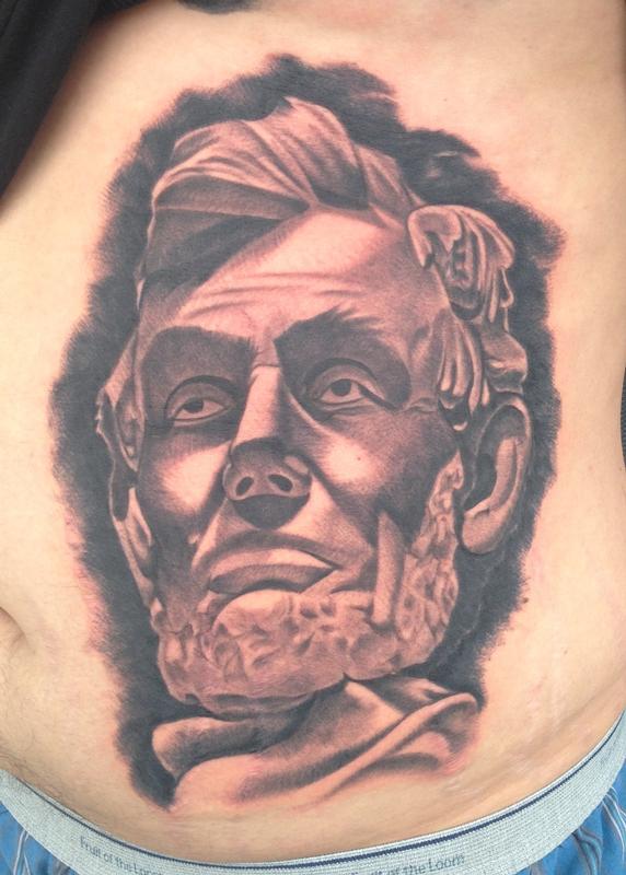 black and gray portrait of Abraham Lincoln tattoo by Scott