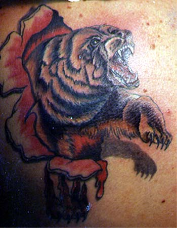 Bad Tattoos - skin rip bear
