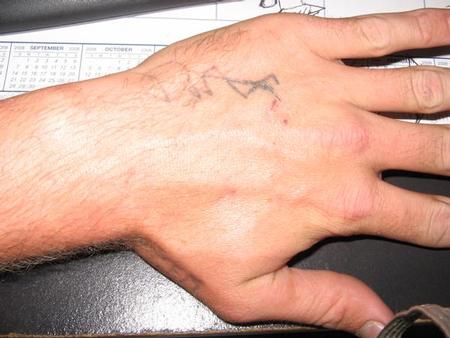 Bad Tattoos - stick figure hand tattoo