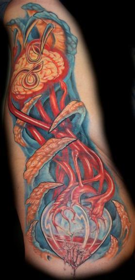 Evan Olin - Bio side piece with brain and glass heart tattoo