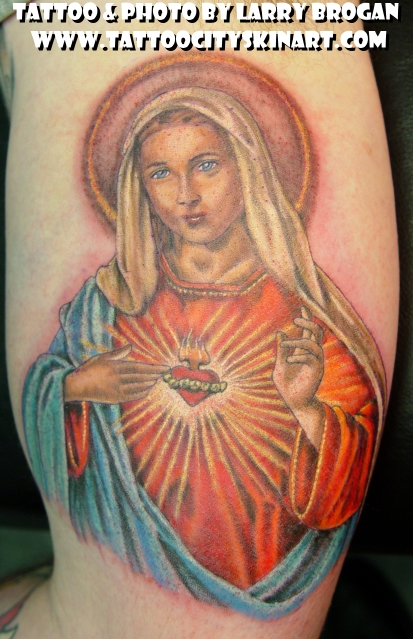 Tattoo on the arm icon of a mammalian meaning Mother of God tattoo