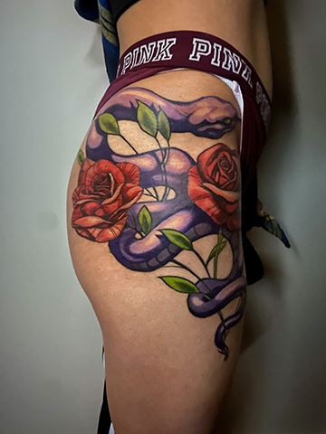 side thigh rose tattoos