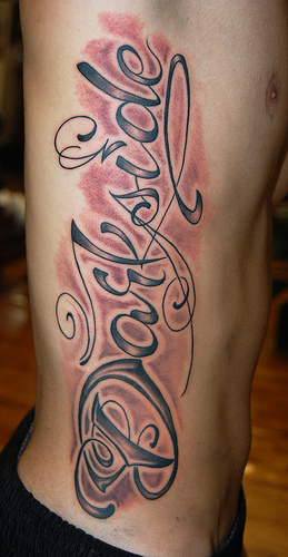 cursive tattoo font on ribs